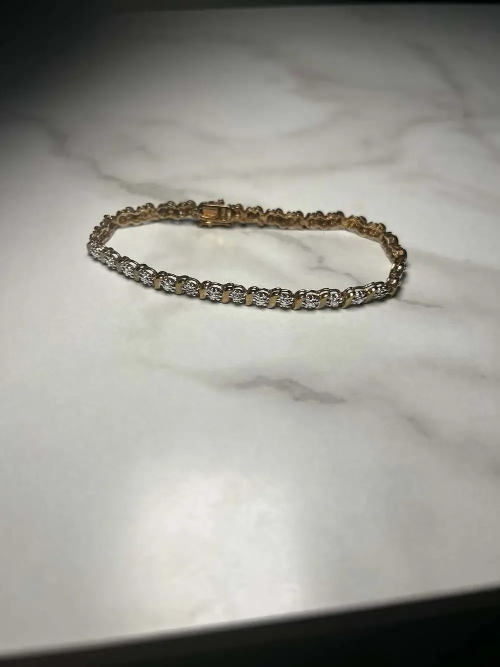 Roman Gold Tone Cubic Zirconia Tennis Bracelet with S-Curve Accents